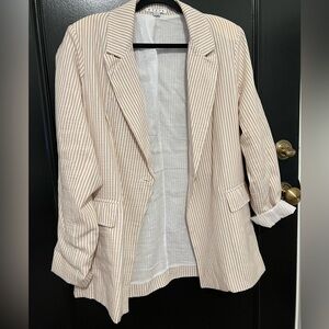 White & taupe striped blazer with shoulder pads.